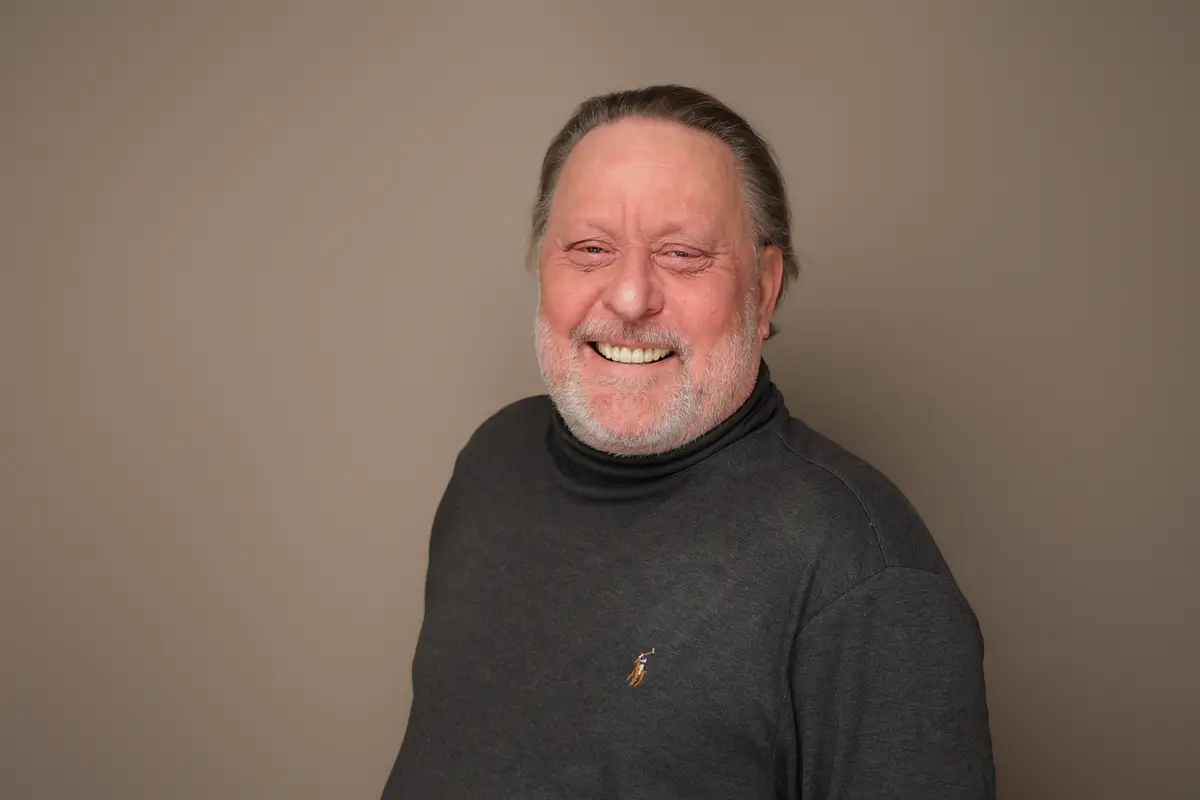 Remko Spaan, founder of Mr. Blitz, smiling in a dark sweater